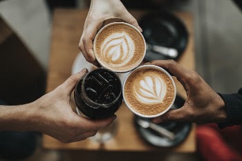 Three people cheering with iced | Free Photo - rawpixel