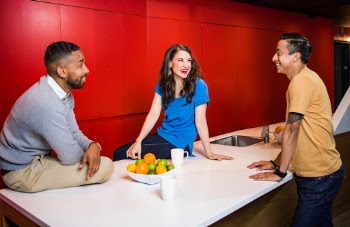 Three People Near Table Talking
