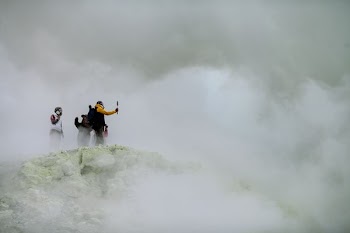 three people on mountain