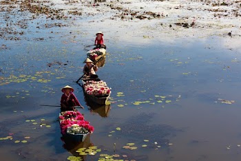 Three Person Riding Kayak Photography