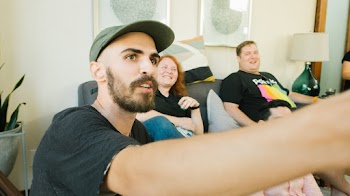 Three Person Siting Inside Room