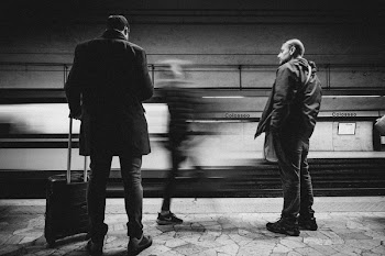 Three Person Standing on Infront of Bullet Train