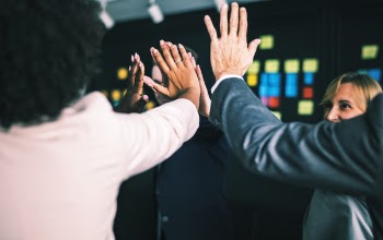 Three Persons Clapping to Each Other