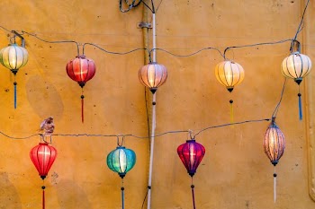 three red and blue hanging candle holders decor