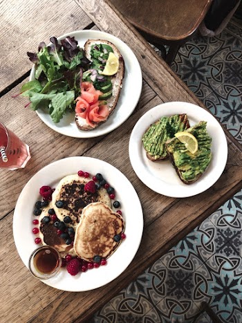 Three Round White Ceramic Plates With Food