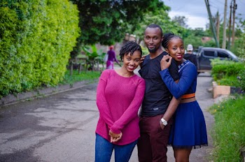 Three Siblings Standing at the Pavement