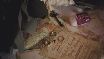 Three Silver-colored Rings Beside Black Skeleton Key