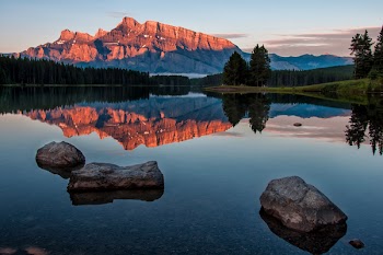 Three Stones on Water Near Mountain