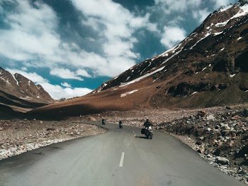 Three Tourist Motorcycles on Road