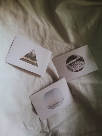 Three White Cards on White Textile
