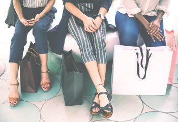 Three Woman Sitting on Chair
