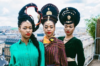 Three Woman Standing Near Fence