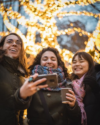 Three Woman Standing on the Ground