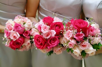 Three Women Holding Bouquet of Pink and Red Hybrid Tea Roses