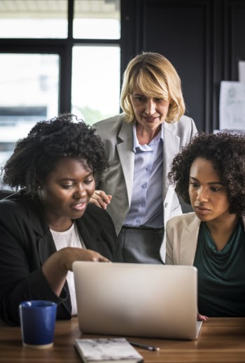Three Women in Front of Laptop Computer