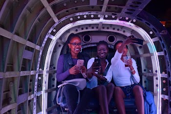 Three Women Taking Selfies