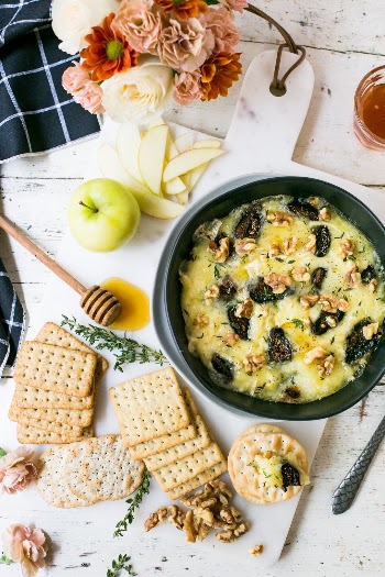 Throw a simple party with grocery store flowers, a cheesy fig dip and an assortment of crackers. 