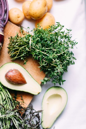 Thyme with avocado and potatoes close up 