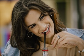 Tilt Shift Focus Photography of Woman Sipping on Straw