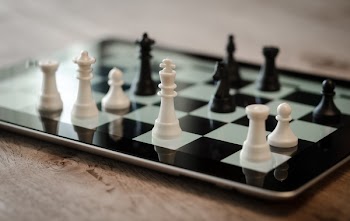 Tilt Shift Lens Photo of Black and White Chess Pieces