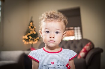 Tilt Shift Lens Photo of Girl Wearing White and Gray Stripe Shirt