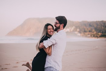 Tilt Shift Lens Photography of Man Hugging Woman