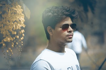 Tilt Shift Lens Photography of Man Wearing White Crew-neck Top