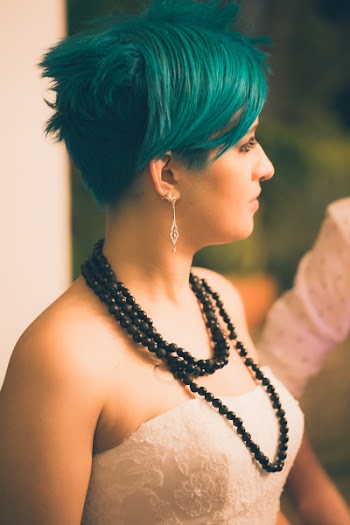 Tilt Shift Lens Photography of Woman Wearing Beaded Black Necklace