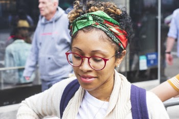 Tilt-shift Lens Photography of Woman Wearing Red-framed Eyeglasses