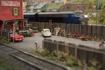 Tilt-shift Photography of White Volkswagen Type 1 on Backyard