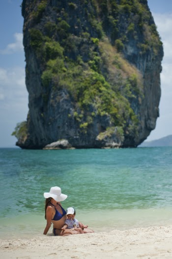 Tilt Shift Photography Of Woman And Son On Beach