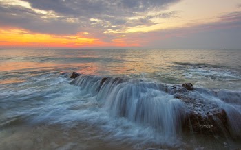 Time-lapse Photo of Body of Water at Golden Hour