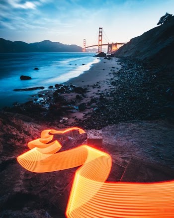 time-lapse photo of bridge near shoreline