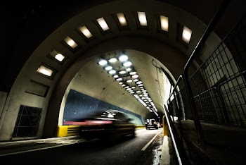 Time Lapse Photo of Car Passing by Tunnel during Nighttime