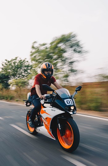 Time Lapse Photo of Man Riding Sports Motorcycle