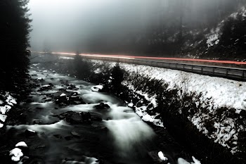 Time Lapse Photo of River Beside Highway during Cloudy Weather