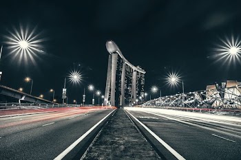 time lapse photo of road near Singapore Marina Bay Sands