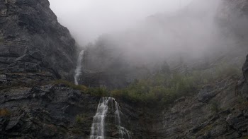 time lapse photo of waterfalls during foggy day