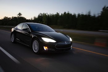 time-lapse photography of black sedan on road