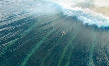 time lapse photography of boat in water with big waves