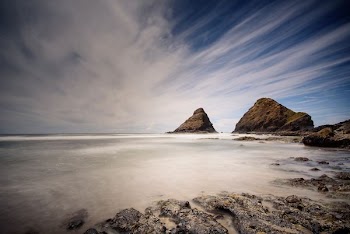 time lapse photography of boulder on body of water