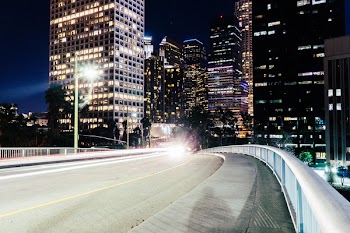 Time-lapse Photography of Bridge Near Buildings at Night