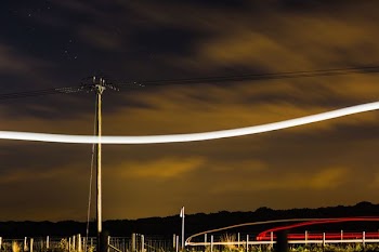 time lapse photography of gray electric post