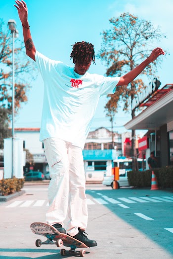 Time Lapse Photography of Man Doing Skateboard Trick