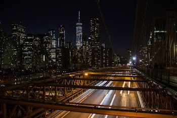 Time-lapse Photography of Moving Vehicle on Bridge at Night