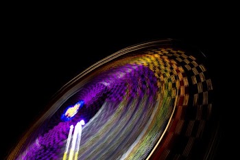 time lapse photography of multicolored amusement ride