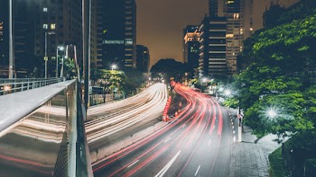 Time-lapse Photography of Passing Vehicles on City Roads at Night