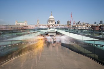 time-lapse photography of people walking on concrete pavement
