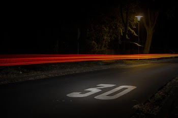 Time Lapse Photography of Red and Orange Light on Road With 30 Print on Nighttime