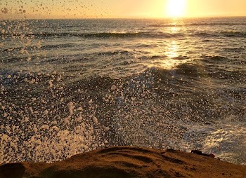 time lapse photography of sea wave splash during golden hour